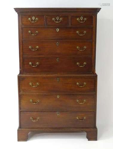 A mid / late 18thC mahogany chest on chest with moulded corn...