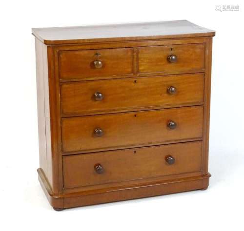 A late 19thC mahogany chest of drawers with a rounded top ed...