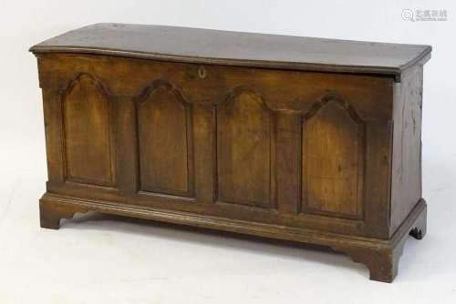 A late 17thC / early 18thC oak coffer with a moulded lid abo...
