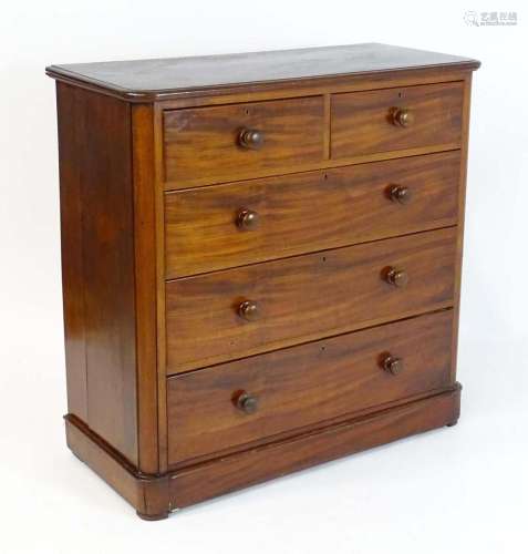 A late 19thC mahogany chest of drawers with a moulded top ab...