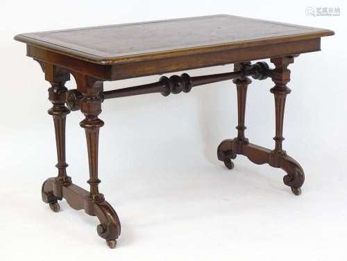 A 19thC mahogany writing table with an inset leather top, ra...