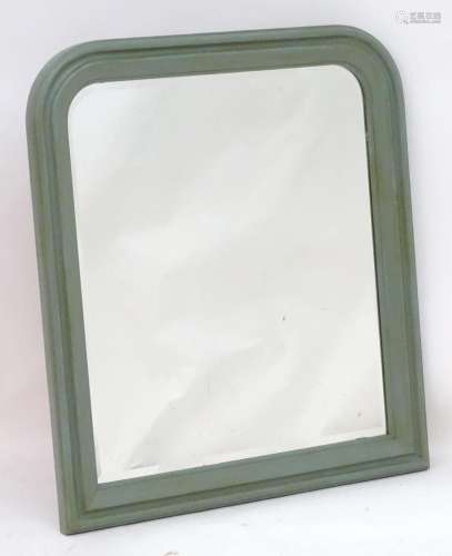 A mid 20thC arched mirror with a painted frame. 34" wid...