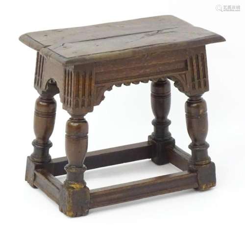 A 17thC and later oak joint stool with a moulded top above a...