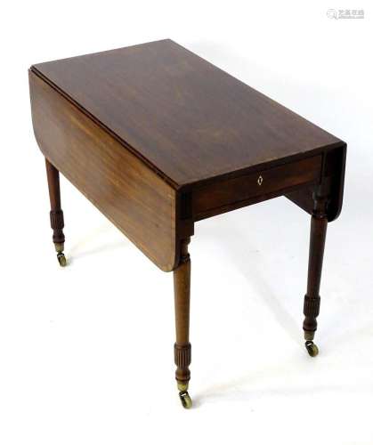 An early / mid 19thC mahogany Pembroke table with a rectangu...
