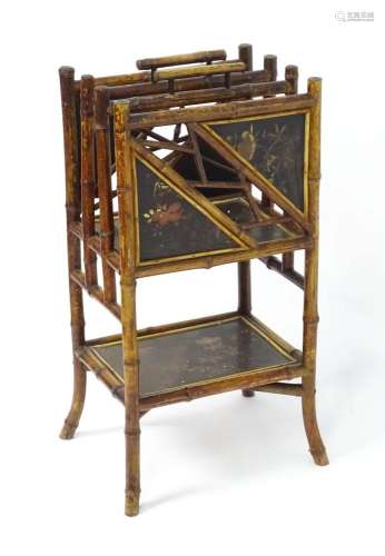A late 19thC aesthetic movement magazine rack with turned ba...