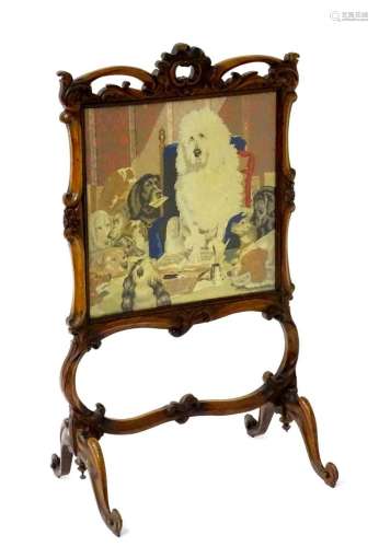 A mid / late 19thC mahogany fire screen with a carved floral...