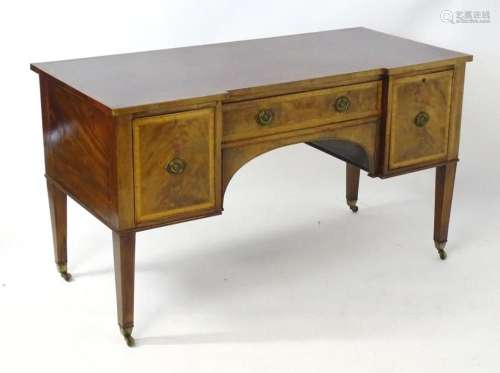 A mid 19thC mahogany desk with an inverted break front top h...