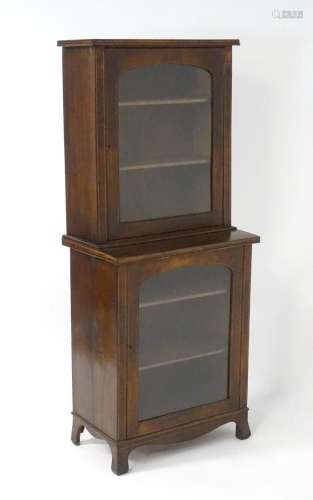 A 19thC walnut glazed bookcase of small proportions with sat...