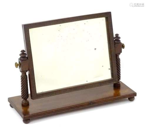 An early / mid 19thC mahogany toilet mirror with a rectangul...
