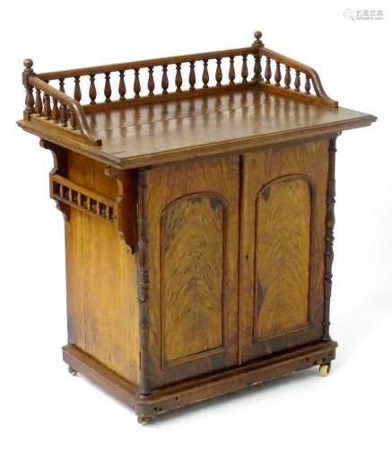 A 19thC walnut galleried cabinet, having turned finials maki...