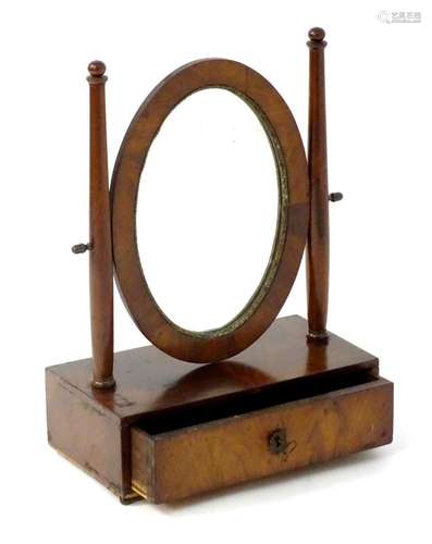 An early 19thC mahogany continental toilet mirror with two t...