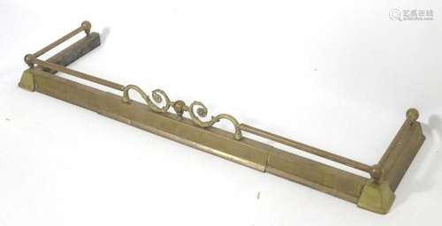 An early 20thC brass extending fire fender, with weighted ca...