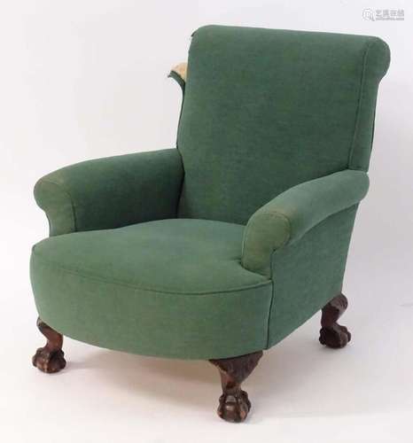 A Green Howard style armchair raised on short acanthus carve...