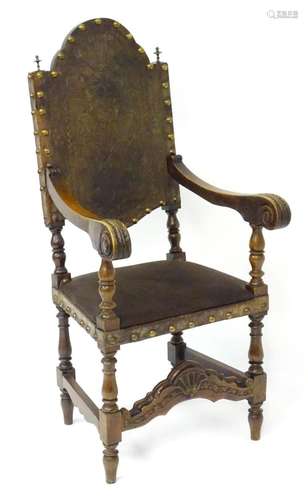 A 19thC Spanish open armchair / elbow chair with an embossed...