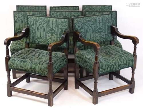 A set of eight late 19thC oak dining chairs, the carvers hav...