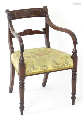 A Regency elbow chair with a shaped top rail with brass inla...