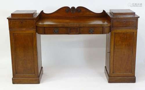 A mid 19thC mahogany double pedestal sideboard of small prop...