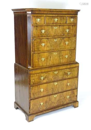 An 18thC walnut chest on chest with a moulded cornice above ...