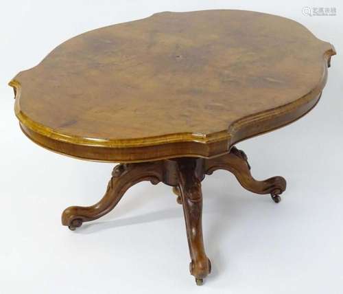 A mid 19thC walnut loo table with a burr walnut veneered top...