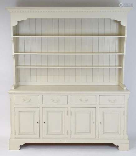 A late 20thC pine dresser, having a moulded cornice above a ...