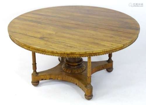 An early / mid 19thC rosewood dining table with a circular t...
