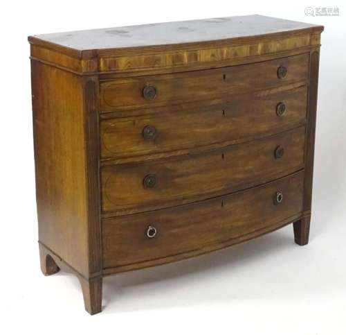 A Regency period mahogany chest of drawers with a shaped ree...