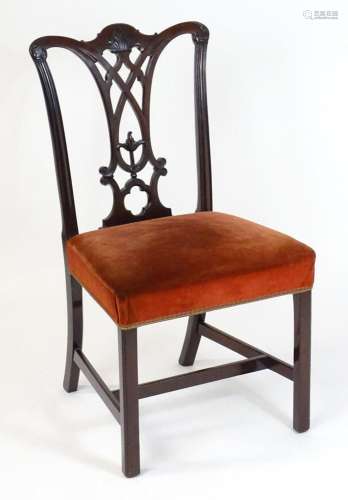 A 19thC mahogany side chair with a shaped and carved crestin...