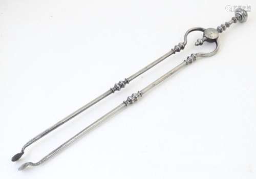 A pair of Georgian steel fire irons / tongs with polished fi...