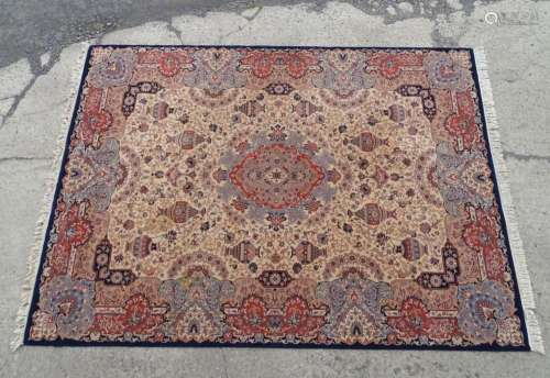 Carpet / rug : A cream ground rug decorated with central flo...