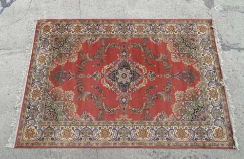 Carpet / rug : A red ground rug decorated with central flora...