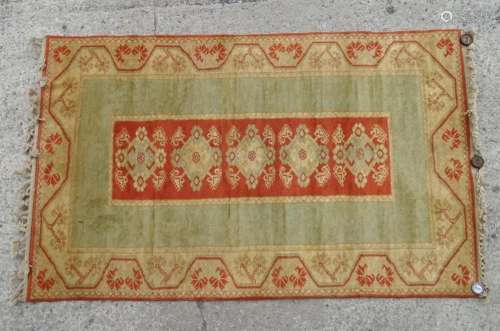 Carpet / rug : A sage green ground rug with central terracot...