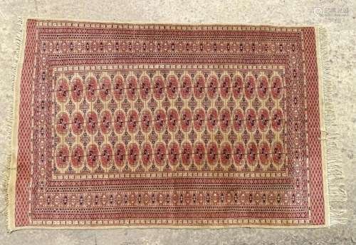 Carpet / Rug : A rug with a red and cream ground decorated w...