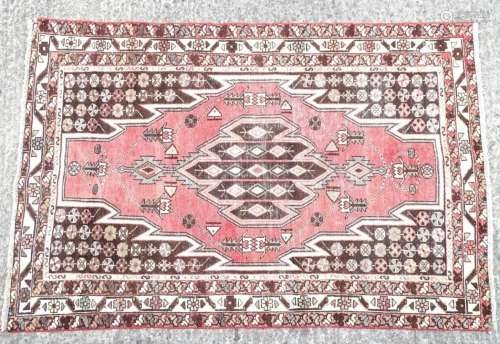 Carpet / rug : An old Mazlaghan pink ground rug decorated wi...