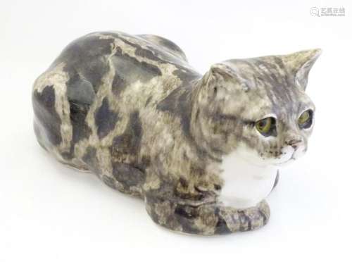 A large Winstanley model of a recumbent Tabby cat. Marked un...