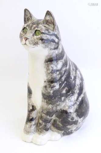 A large Winstanley model of a seated Tabby cat with green ey...