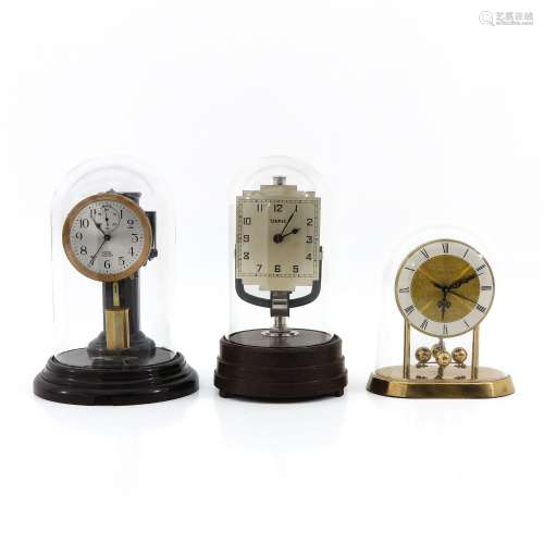 A Lot of 3 Electric Clocks Under Glass Domes