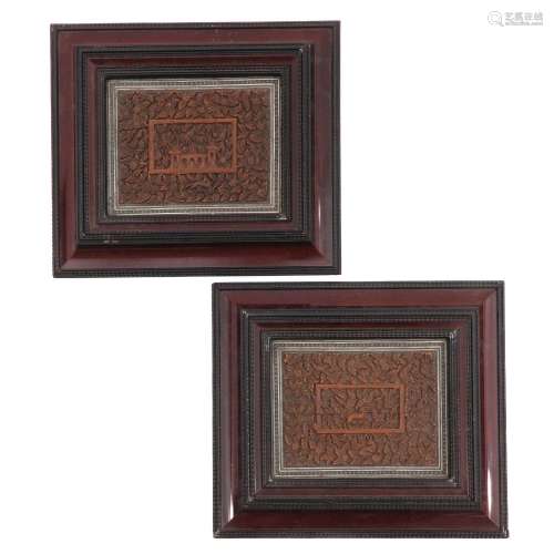 A Pair of Framed Carved Book Covers