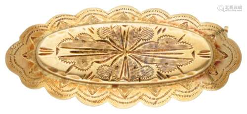 Antique 14K. yellow gold brooch with engraved details.