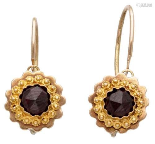 14K. Yellow gold earrings set with garnets.