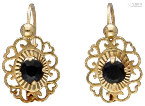 18K. Yellow gold earrings set with approx. 0.32 ct. sapphire...