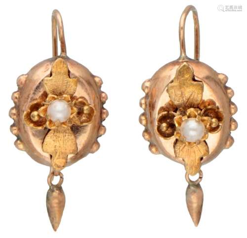Antique 14K. bicolor gold earrings set with a pearl.