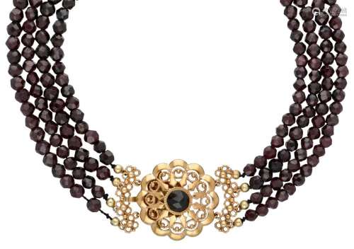 Three-row garnet necklace with a 14K. yellow gold closure.