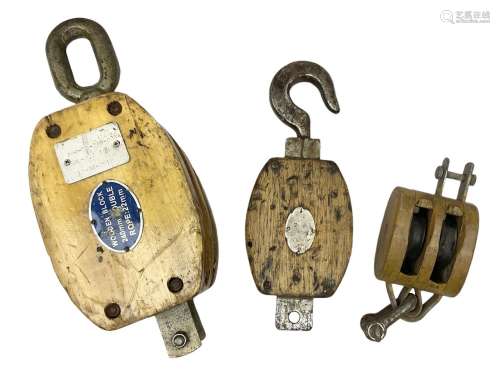 Three ship pulleys comprising wooden block double with swive...