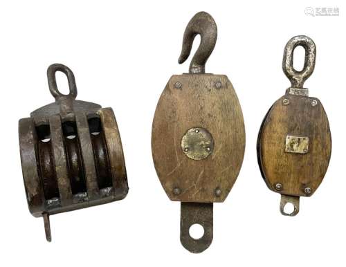 Three ship pulleys comprising wooden block double with stiff...