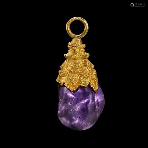 . A gold pendant with amethyst pebble Java, Indonesia, 7th -...