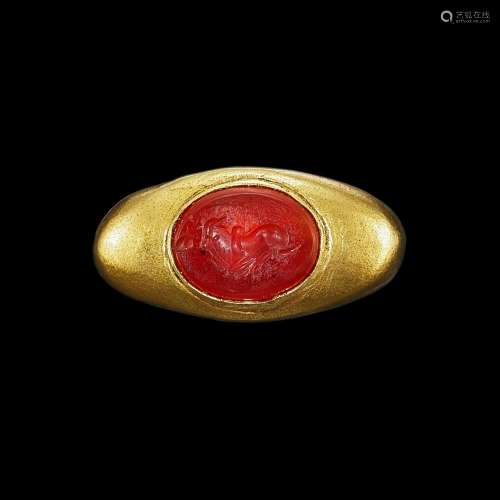 . A solid gold ring with carnelian intaglio of Nandi Khmer, ...
