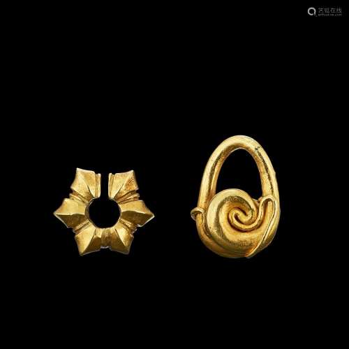 . Two solid gold earrings Java, Indonesia, 7th - 12th centur...