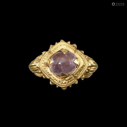 . A solid gold and amethyst ring with layered bezel Khmer, 7...