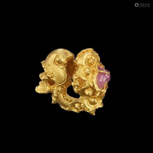 . A solid gold and semi-precious stone ornament Java, Indone...