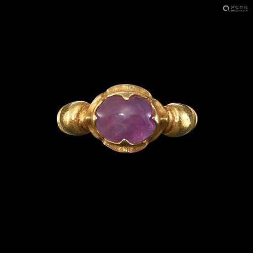. A gold and amethyst ring with ribbed shank Java, Indonesia...